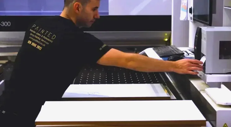 A Painted operator labelling a cut panel at the beam saw