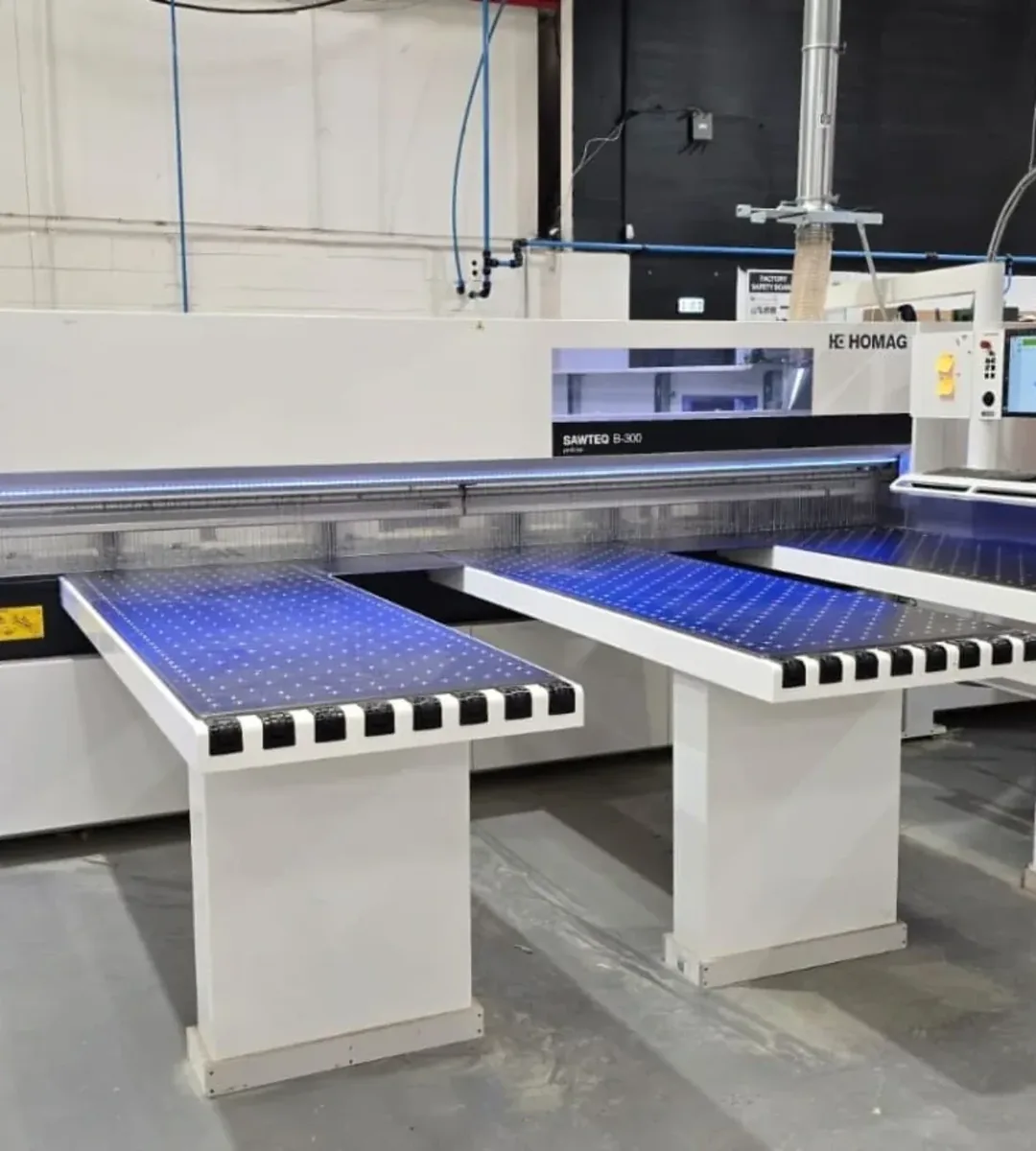 Sheet material being cut on the beam saw in the Croydon workshop