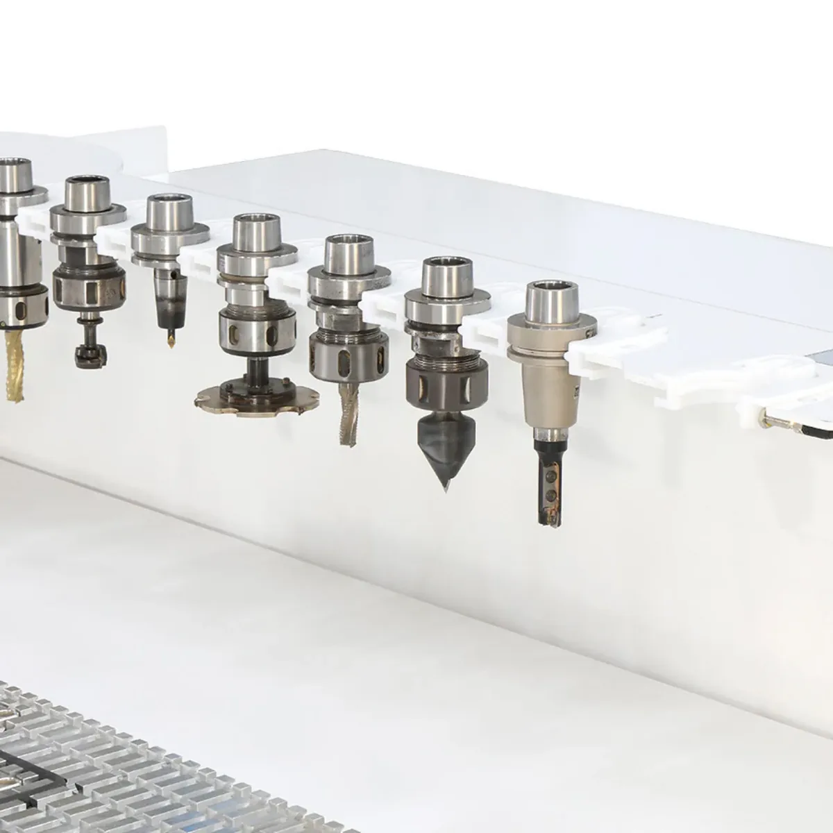 Linear tool changer holding precision drill and milling bits