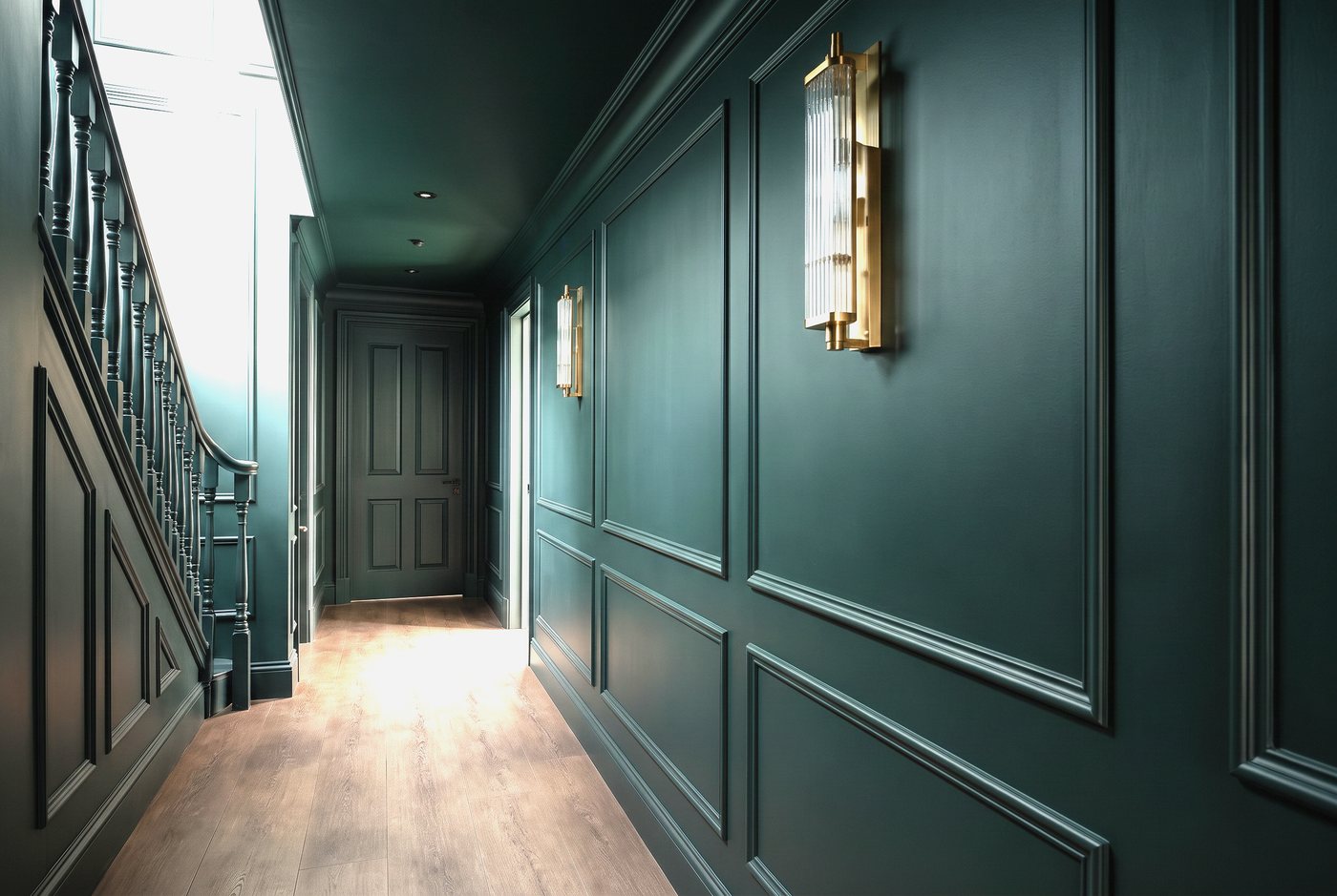Framed hall panelling with a bench seat and coat hooks