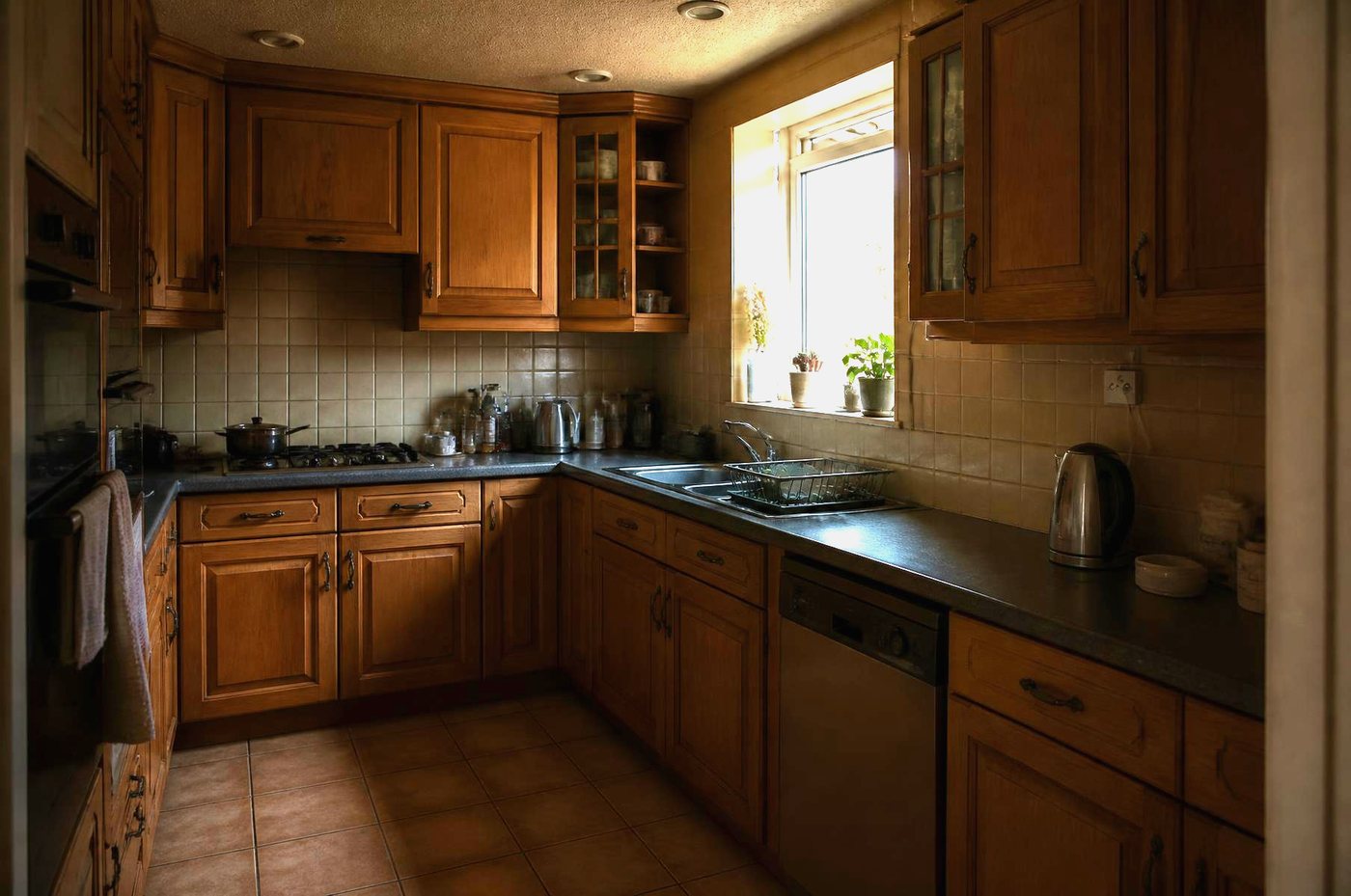 Tired oak-effect kitchen before respraying